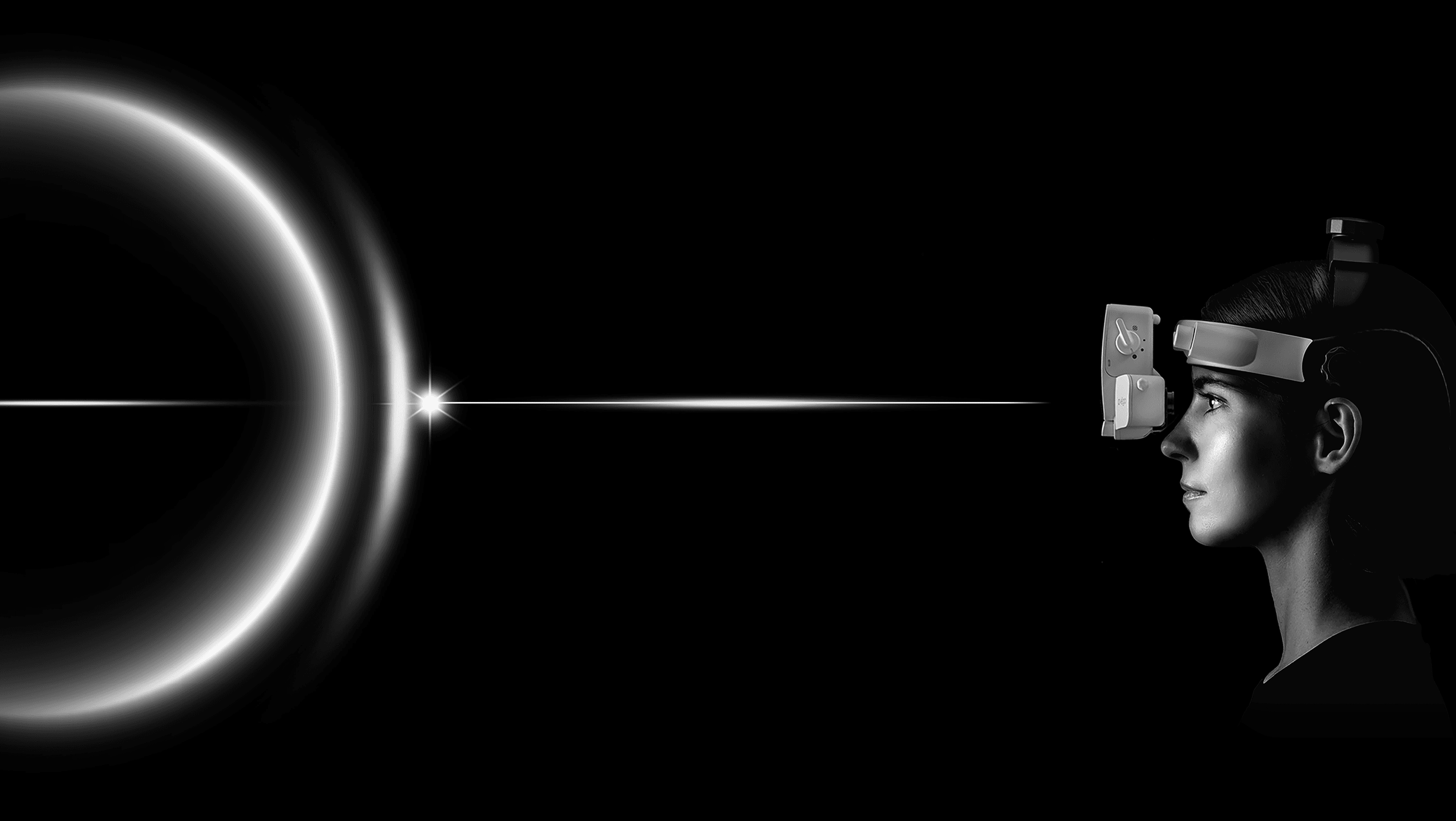 Physician wearing IO-Vega binocular indirect ophthalmoscope examining a patient's eye